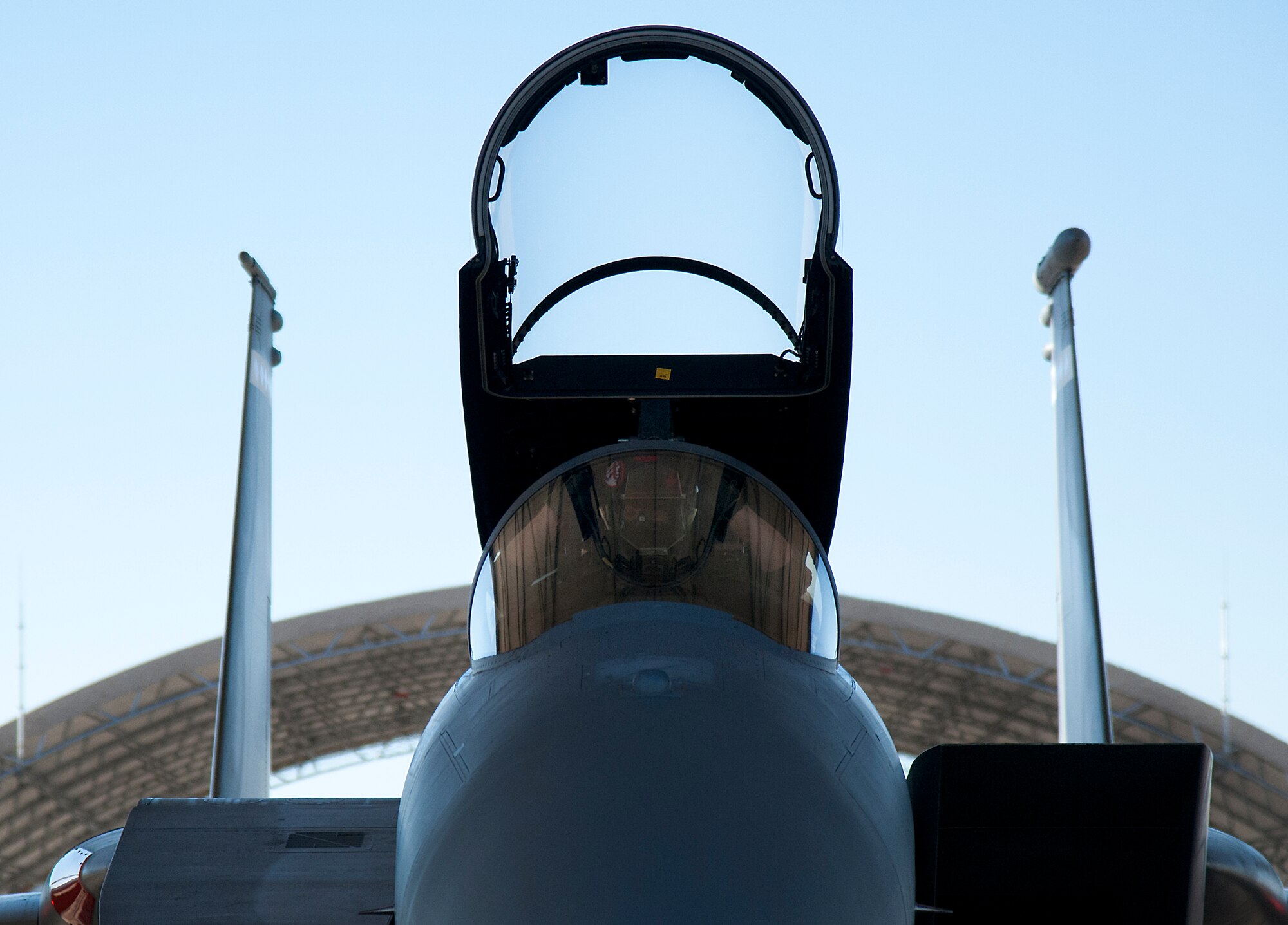 Maj. Christopher Wee, Operation Flight Program Combined Test Force, adjusts his helmet prior to his morning F-15 Eagle sortie at Eglin Air Force Base, Fla.  The OFPCTF Airmen fly test missions exclusively in various F-15 models. The OFPTCF is partially owned by both the 53rd Wing and 96th Test Wing. (U.S. Air Force photo/Samuel King Jr.)