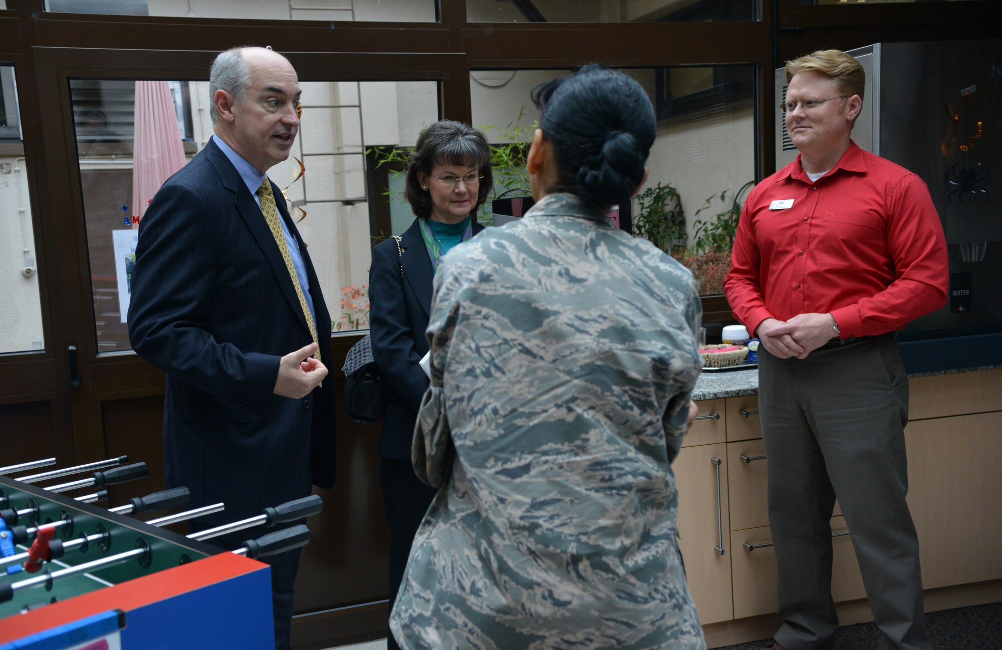 Dr. J.D. Crouch (left), USO’s president and CEO, takes a tour of the USO at the Contingency Aeromedical Staging Facility on Ramstein Air Base, Germany, Oct. 28, 2014. Crouch and his wife came to Ramstein to visit different USOs in the region. (U.S. Air Force photo/Senior Airman Hailey Haux)