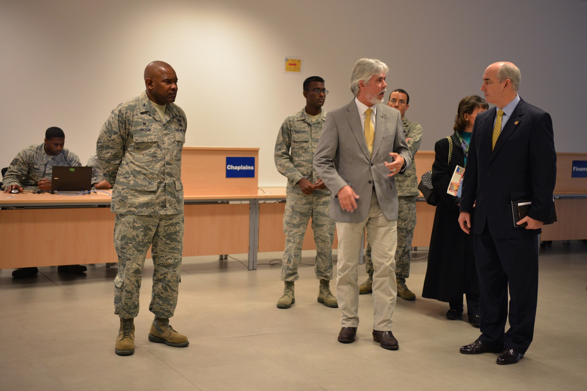 Dr. J.D. Crouch (right), USO’s president and CEO, takes a tour of the Joint Mobility Processing Center on Ramstein Air Base, Germany, Oct. 28, 2014. Crouch and his wife came to Ramstein to visit different USOs in the region. (U.S. Air Force photo/Senior Airman Hailey Haux)