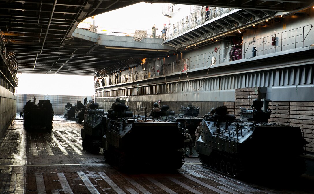 Marines and Assault Amphibious Vehicles aboard the USS Germantown prepare to depart for Camp Schwab, Japan during exercise Blue Chromite 2014 Nov. 1. Blue Chromite exercises the interoperability and joint capabilities of U.S. Navy and Marine Corps forces and increases the amphibious proficiency of participating units. The Marines and AAV’s are with Combat Assault Battalion, 3rd Marine Division, III Marine Expeditionary Force. 