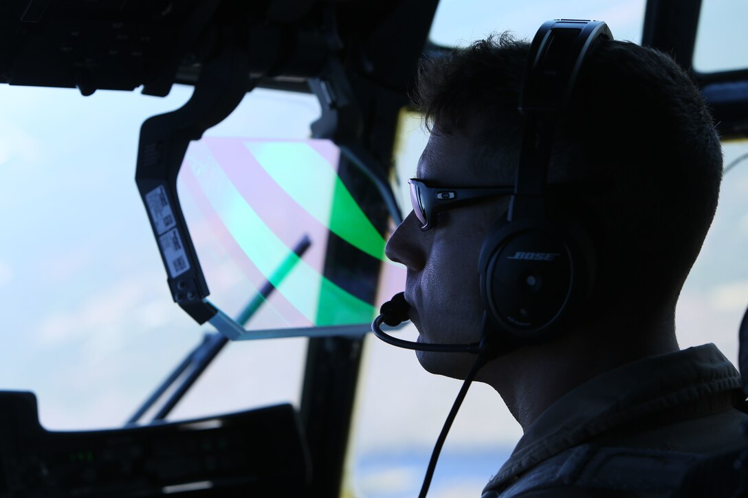 Capt. Mike A. Jordan pilots a KC-130J Super Hercules during tactical navigation training at Hunter Army Airfield, Ga., Oct. 23, 2014. The training allows pilots to hone skills through terrain disparate to avoid ground threats. Jordan is a naval aviator with Marine Aerial Refueler Transport Squadron 252 and native to Decatur, Texas.