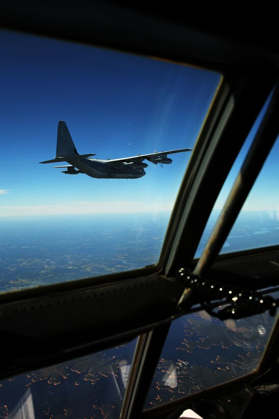 Marines with Marine Air Refueler Transport Squadron 252 pilot a KC-130J Super Hercules during a Tactical Navigation training flight at Hunter Army Airfield, Ga., Oct. 23, 2014. The training allows pilots to hone skills through disparate terrain to avoid ground threats.