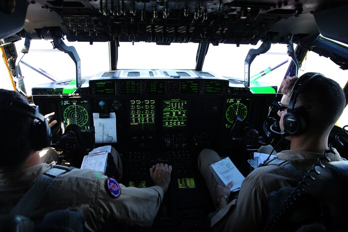 Capt. Orlando R. Samudio, left, and Capt. Mike A. Jordan pilot a KC-130J Super Hercules during tactical navigation training above Hunter Army Airfield, Ga., Oct. 23, 2014. The training allows pilots to hone skills through disparate terrain to avoid ground threats. Samudio and Jordan are both naval aviators with Marine Aerial Refueler Transport Squadron 252. Samudio is a native of Austin, Texas and Jordan is a native to Decatur, Texas.