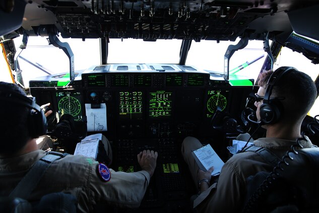 Capt. Orlando R. Samudio, left, and Capt. Mike A. Jordan pilot a KC-130J Super Hercules during tactical navigation training above Hunter Army Airfield, Ga., Oct. 23, 2014. The training allows pilots to hone skills through disparate terrain to avoid ground threats. Samudio and Jordan are both naval aviators with Marine Aerial Refueler Transport Squadron 252. Samudio is a native of Austin, Texas and Jordan is a native to Decatur, Texas.