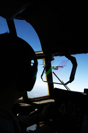 Capt. Orlando R. Samudio pilots a KC-130J Super Hercules during a tandem training flight above Hunter Army Airfield, Ga., Oct. 24, 2014. The pilots honed skills pertaining to disparate terrain to avoid ground threats. Samudio is a naval aviator with Marine Aerial Refueler Transport Squadron 252 and native of Austin, Texas.