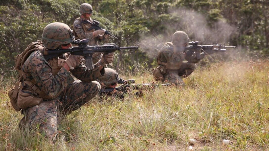 Marines attack their objective Nov. 2 during exercise Blue Chromite 15 in the Central Training Area. Blue Chromite demonstrates the Navy and Marine Corps’ expeditionary capabilities from the sea. Marines rode in assault amphibious vehicles in a ship-to-shore assault from the USS Germantown to Oura Wan Beach. After securing their first objective Marines advanced inland to the CTA. The Marines are with 2nd Battalion, 9th Marine Regiment, currently assigned to 4th Marines Regiment, 3rd Marine Division, III Marine Expeditionary Force. (U.S. Marine Corps Photo by Lance Cpl. Abbey Perria/Released)