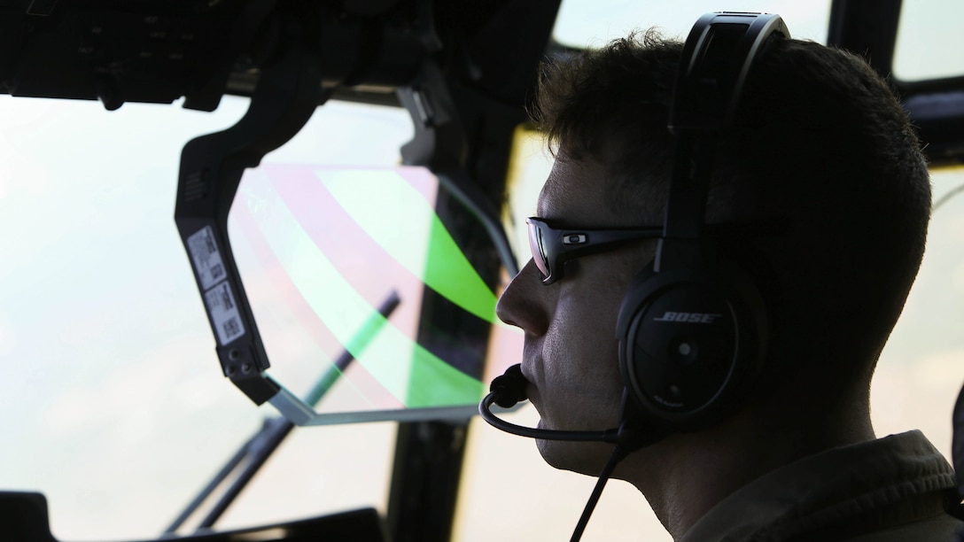Capt. Mike A. Jordan pilots a KC-130J Super Hercules during tactical navigation training at Hunter Army Airfield, Ga., Oct. 23, 2014. The training allows pilots to hone skills through terrain disparate to avoid ground threats. Jordan is a naval aviator with Marine Aerial Refueler Transport Squadron 252 and native to Decatur, Texas.