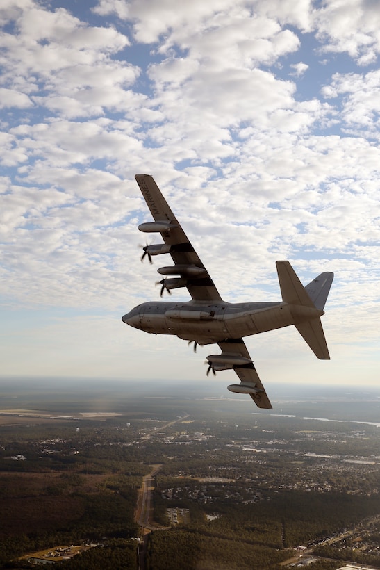 A KC-130J Super Hercules banks during a flight toward Hurlburt Air Force Base, Fla., to conduct an aerial delivery and insertion with United States Special Operations Command Oct. 24, 2014. The Hercules belongs to Marine Aerial Refueler Transport Squadron 252.