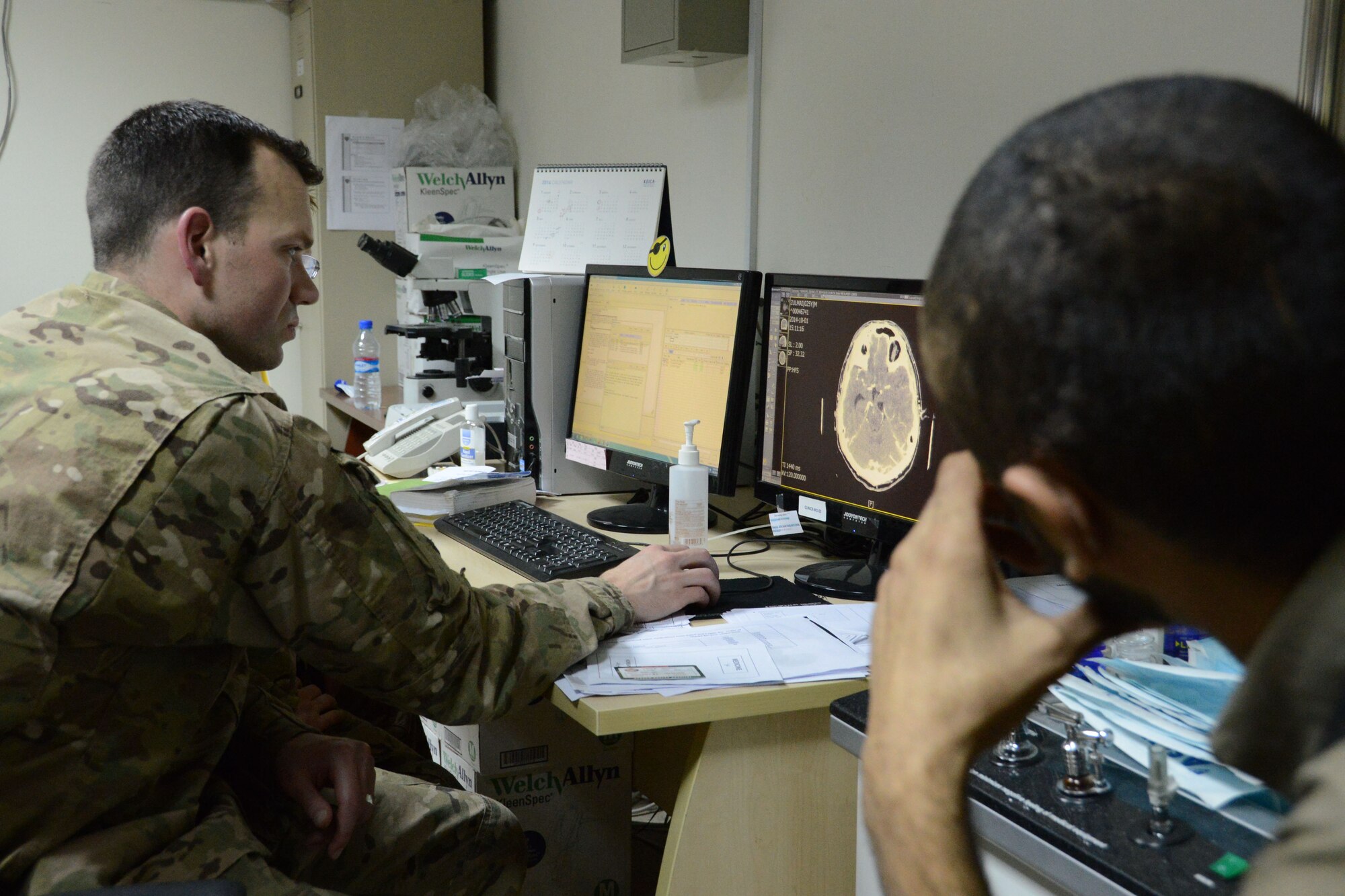 U.S. Air Force Maj. Jonathan Forbes, a neurosurgeon assigned to the 455th Expeditionary Medical Group, reviews a scan of the brain of a patient during a follow-up consultation Oct. 22 at the Korean Humanitarian Hospital at Bagram Airfield, Afghanistan. Forbes, a native of New Martinsville, West Virginia removed a tumor from the man’s brain 12 days prior to this visit. (U.S. Air Force photo by Master Sgt. Cohen A. Young/Released)