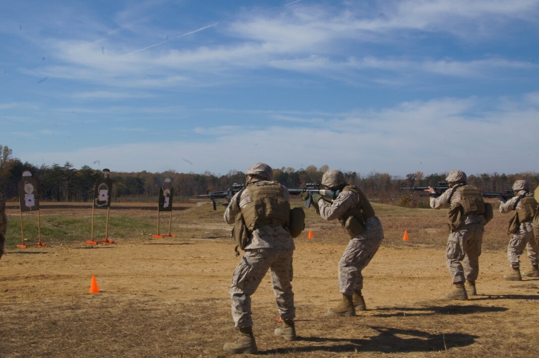 Marines from Marine Corps Institute Company, Marine Barracks Washington, D.C. engage targets during live-fire, combat marksmanship training on Range 14, Marine Corps Base Quantico.