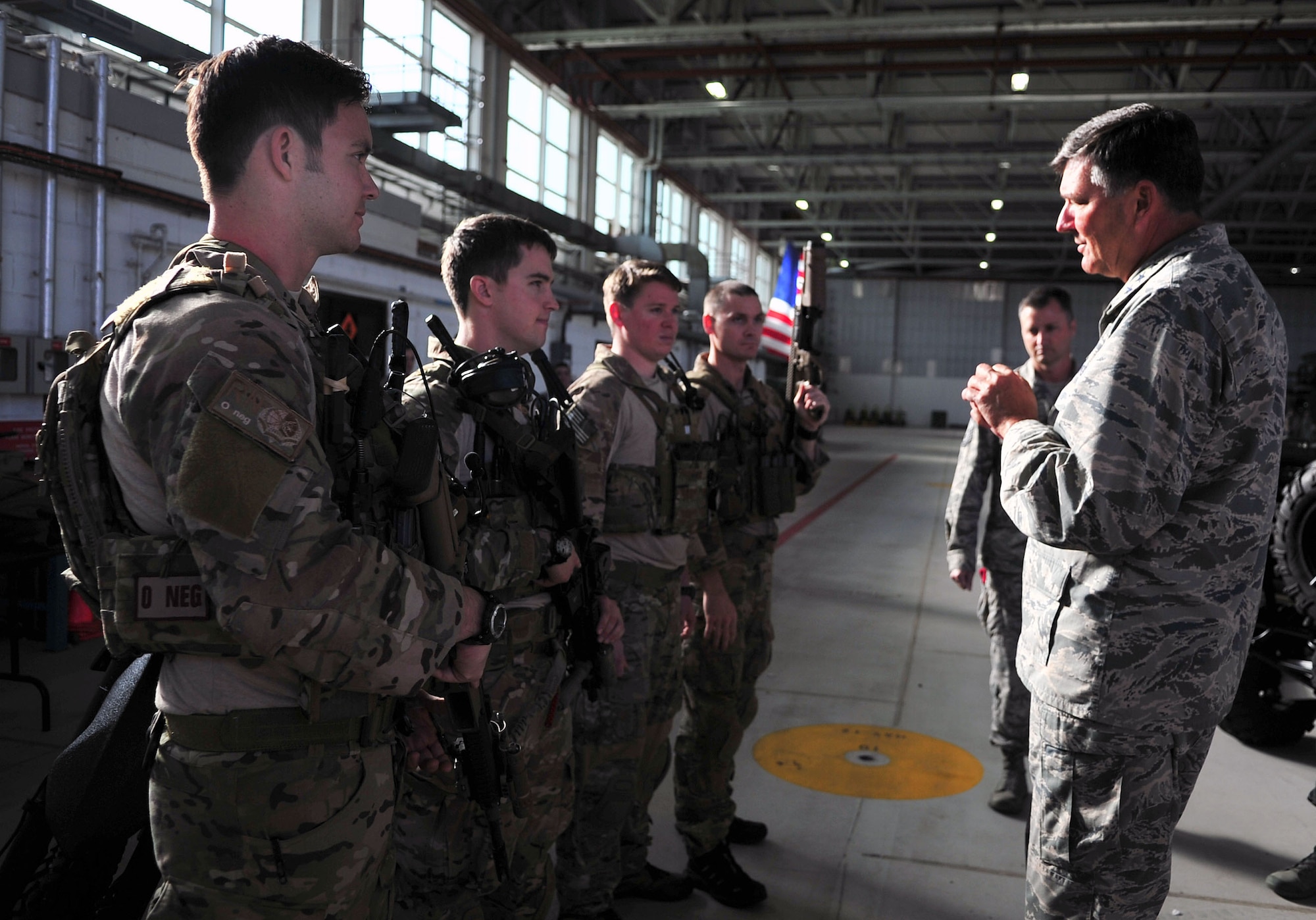 Lt. Gen Bradley A. Heithold, right, Air Force Special Operations Command commander, speaks with Air Commandos from the 321st Special Tactics Squadron, Oct. 27, 2014, on RAF Mildenhall, England. Heithold visited Air Commandos at various units to discuss the AFSOC mission to as ensure morale is at its highest. (U.S. Air Force photo by Senior Airman Christine Griffiths)

