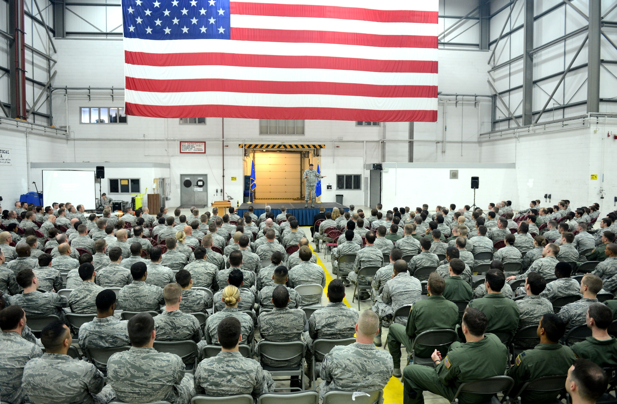 Air Commandos listen while Lt. Gen. Bradley Heithold, Air Force Special Operations Command commander, speaks during the 352nd Special Operations Group All-Call in hangar 803 Oct. 27, 2014, on RAF Mildenhall, England. Heithold visited a multitude of Airmen and their workplaces to discuss important matters, get a better understanding of their needs to accomplish the mission as well as deliver his vision and priorities. (U.S. Air Force photo by Senior Airman Kate Maurer)