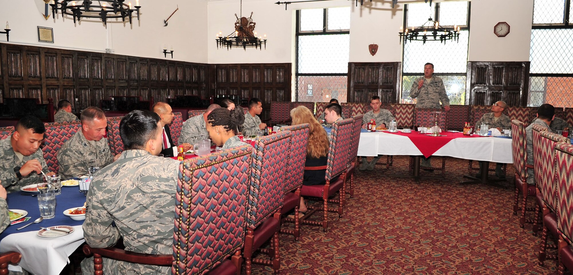 Lt. Gen. Bradley A. Heithold, standing, Air Force Special Operations Command commander, speaks with Airmen during a luncheon at the Gateway Dining Facility, Oct. 27, 2014, on RAF Mildenhall, England. Heithold visited Air Commandos at various units to discuss the AFSOC mission and to ensure morale is at its highest. (U.S. Air Force photo by Senior Airman Christine Griffiths)