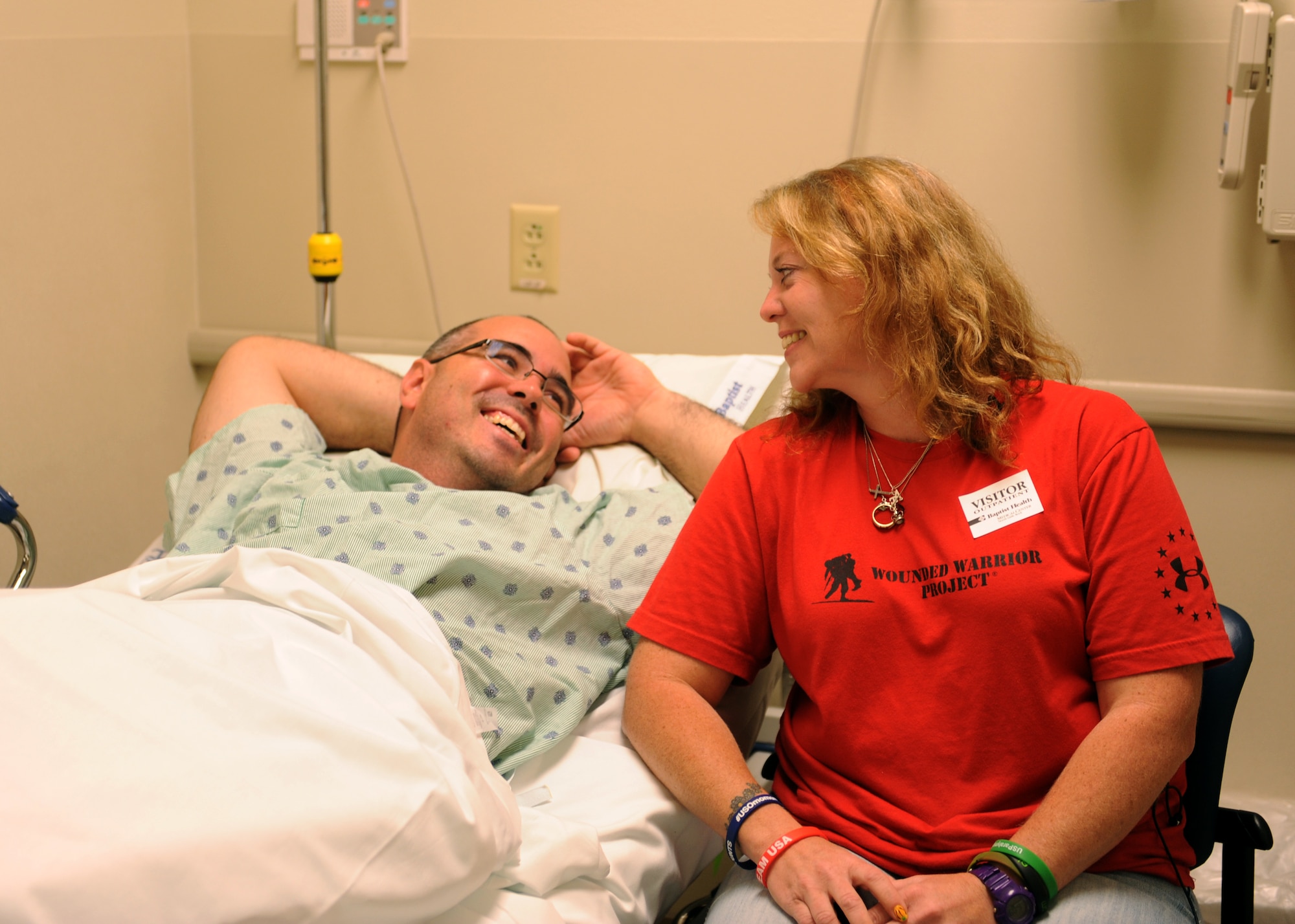 Tech. Sgt. Jason Caswell and his wife, Tami, share a moment before he enters surgery Oct. 17, 2014, at the Baptist Health Medical Center, Little Rock, Ark. Caswell injured his leg while playing rugby, and has suffered multiple complications, which led up to him choosing amputation of his leg. Caswell is a 19th Aircraft Maintenance Squadron crew chief. (U.S. Air Force photo/Airman 1st Class Scott Poe)