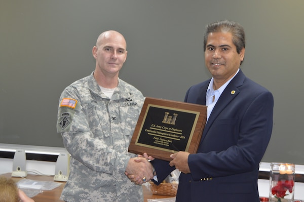 Pablo Vazquez-Ruiz receives the Construction Management Excellence award from district commander, Col. Alan Dodd. The award recognizes district personnel who exhibit excellence in construction management and contract administration activities.