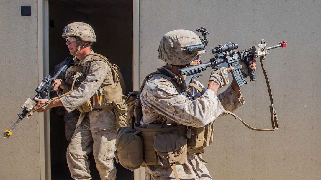 U.S. Marines with Lima Company, Battalion Landing Team 3rd Battalion, 1st Marine Regiment, 15th Marine Expeditionary Unit, sweep through a training area during a vertical-assault raid course aboard Camp Pendleton, Calif., Oct. 29, 2014. The course teaches vertical assault techniques and the importance of working together as a cohesive unit during a raid. 