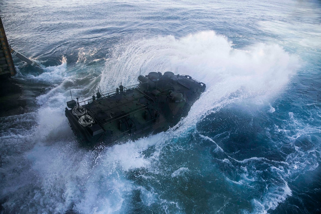 Marines launch their Assault Amphibious Vehicle from the hull of the USS Germantown (LSD 42) Nov. 2 during exercise Blue Chromite 15. Blue Chromite demonstrates the Navy and Marine Corps’ amphibious and expeditionary capabilities from the sea. The Marines are with Combat Assault Battalion, 3rd Marine Division, III Marine Expeditionary Force. 