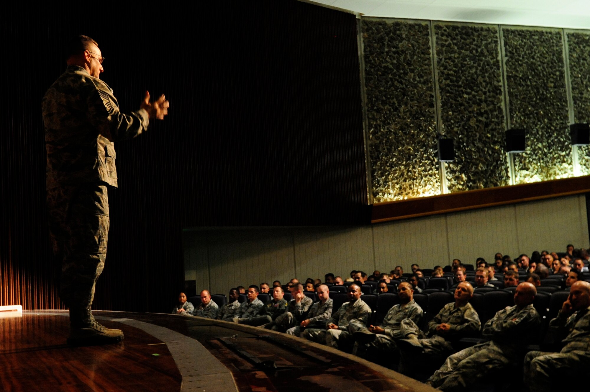 U.S. Air Force Chief Master Sgt. Harold Hutchison, Pacific Air Forces command chief, speaks to Airmen of the 18th Wing during an enlisted all-call on Kadena Air Base, Japan, Oct. 28, 2014. During the all-call Hutchison addressed the new changes in today's Air Force to include enlisted performance reports, Developmental Special Duties, and the Airman innovative program. Hutchison ended with a question and answer session to find out what is affecting today's Airmen. (U.S. Air Force photo by Airman 1st Class Keith James/Released)