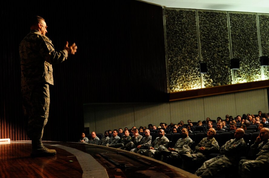 U.S. Air Force Chief Master Sgt. Harold Hutchison, Pacific Air Forces command chief, speaks to Airmen of the 18th Wing during an enlisted all-call on Kadena Air Base, Japan, Oct. 28, 2014. During the all-call Hutchison addressed the new changes in today's Air Force to include enlisted performance reports, Developmental Special Duties, and the Airman innovative program. Hutchison ended with a question and answer session to find out what is affecting today's Airmen. (U.S. Air Force photo by Airman 1st Class Keith James/Released)