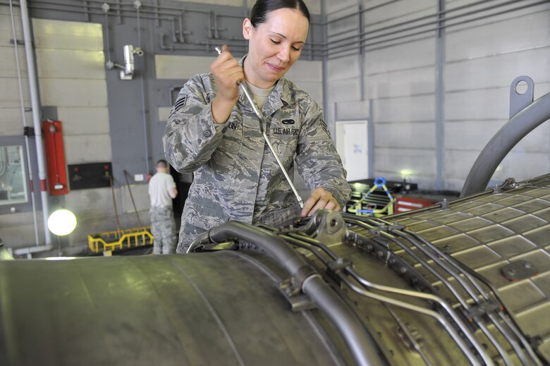 U.S. Air Force Senior Airman Brittney Rogerson, 35th Maintenance Group test cell technician, works on the engine of an F-16 Fighting Falcon at Misawa Air Base, Japan, Oct. 31, 2014. Rogerson’s daily responsibilities include supporting Misawa’s centralized repair facility through troubleshooting, maintaining and operating as ground personnel for F-16 engines. (U.S. Air Force photo by Airman 1st Class Patrick S. Ciccarone/Released)
