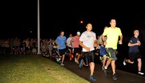 Members of the 353rd Special Operations Group and other participants run in support of the Kadena Special Olympics on Kadena Air Base, Japan, Oct. 31, 2014. The 353rd Special Operations Group hosted 128 runners and 52 volunteers at the Kadena Special Olympics 5k fun run which was help to raise awareness for the KSO scheduled for Nov. 8. (U.S. Air Force photo by Naoto Anazawa/Released)