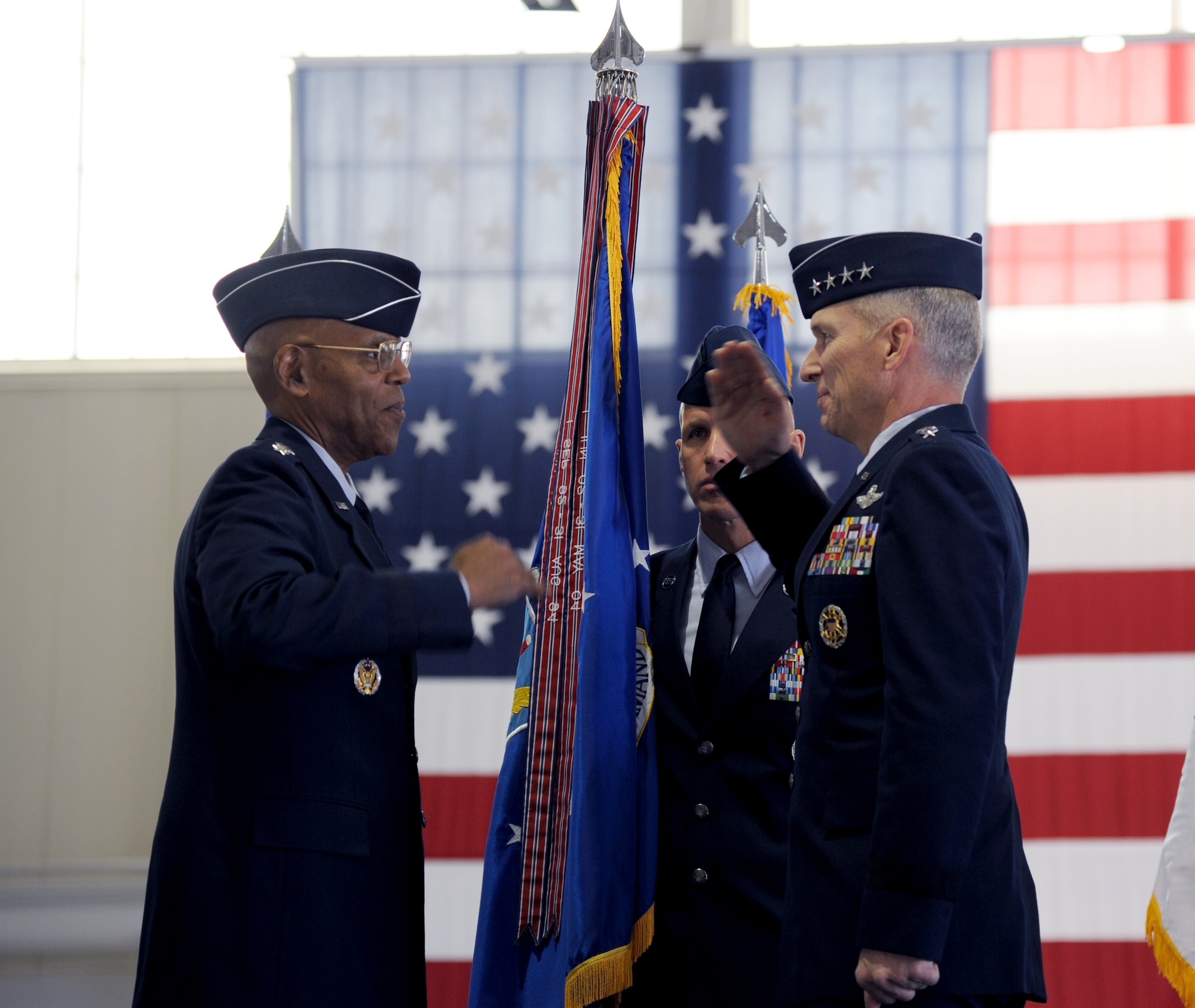 U.S. Air Force Gen. Mike Hostage renders one of his final salutes as commander of Air Combat Command to U.S. Air Force Vice Chief of Staff Gen. Larry O. Spencer during the change of command ceremony at Langley Air Force Base, Va., Nov. 4, 2014. Hostage also retired after 37 years of service in the Air Force. (U.S. Air Force photo by Staff Sgt. Candice Page/Released)