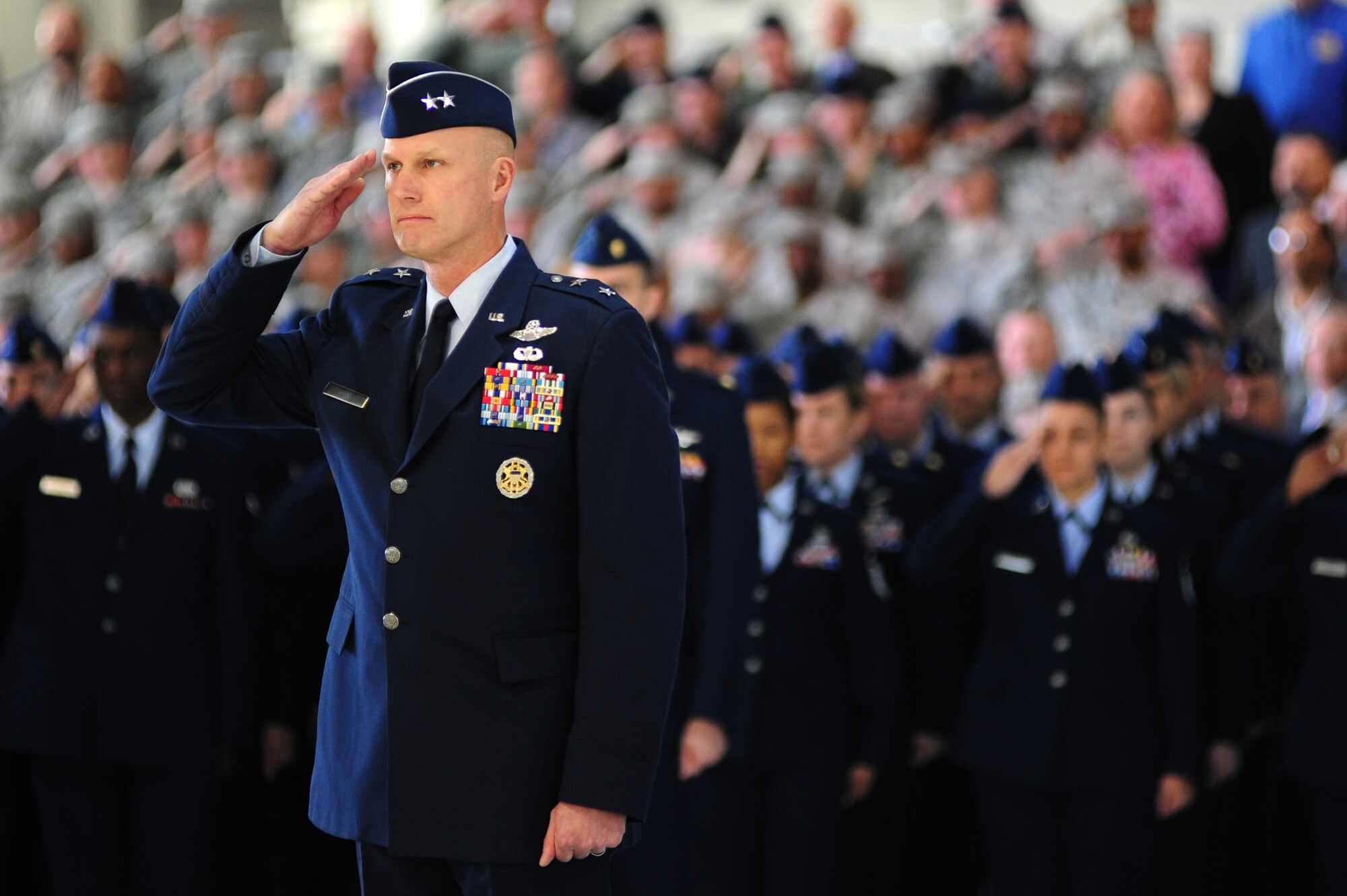 U.S. Air Force Maj. Gen. James N. Post III, vice commander of Air Combat Command leads the command’s Airmen in offering a salute as the National Anthem plays during the ACC change of command ceremony at Langley Air Force Base, Va., Nov. 4, 2014. Gen. Hawk Carlisle assumed command from Gen. Mike Hostage, who retired after more than 37 years of Air Force service. (U.S. Air Force photo by Airman 1st Class Areca T. Wilson/Released) 