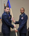 Maj. Ronald Spencer Jr., right, assumes command of Detachment 4 of the 561st Network Operations Squadron from Lt. Col. Roy Rockwell, 561st NOS commander, Nov. 4 at Malmstrom Air Force Base, Mont. The detachment is based at Malmstrom and provides secure data, voice, and video teleconferences for over 6,000 users and over 80 sites. (U.S. Air Force photo/John Turner)