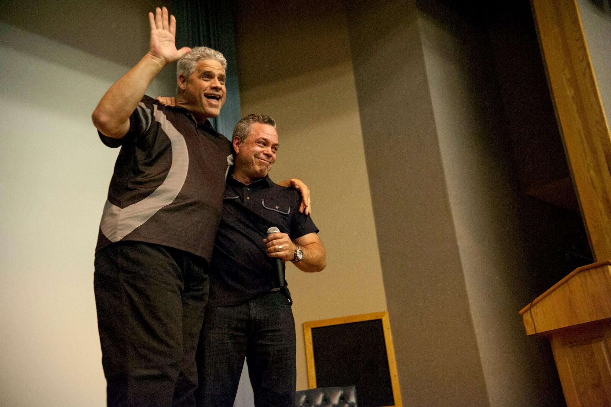 Bernie McGrenahan, right, a standup comedian and motivational speaker, hugs his brother Sean after one of Bernie’s ‘Happy Hour’ comedy tour performances ends at Anderson Hall on Laughlin Air Force Base, Texas, Oct. 30, 2014. Sean suffered a stroke at birth that affected his development. Sean plays a large part in the personal story Bernie weaves for his audience during his performances and is used to remind people of the importance of looking out for others. (U.S. Air Force photo by Staff Sgt. Nathan Maysonet) (Released)
