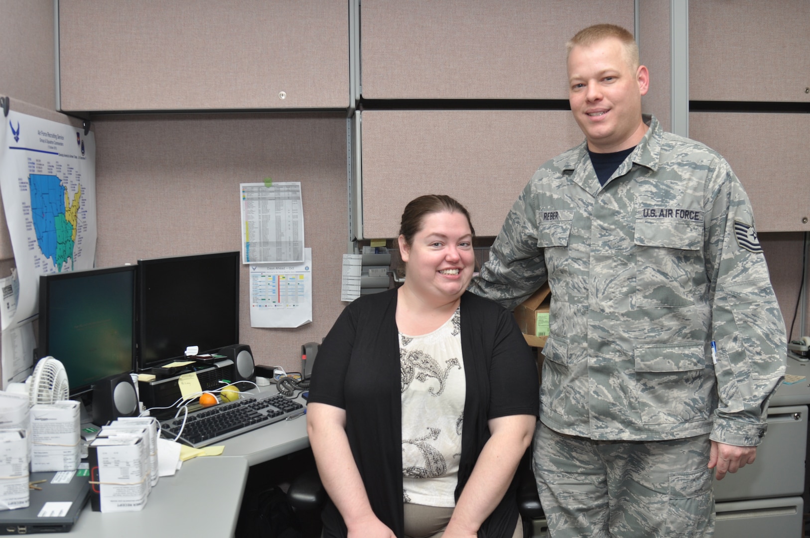Tech. Sgt. Daniel Reber, Headquarters Air Force Recruiting Service client systems technician, and his wife, Tanya Reber, Headquarters AFRS Key Spouse, use teamwork to accomplish the mission.  The couple combines social media concepts and delivery to create an online information exchange for the spouses of personnel assigned to the headquarters. They also want to reach out to AFRS spouses worldwide. (U.S. Air Force photo/Tech. Sgt. Hillary Stonemetz)