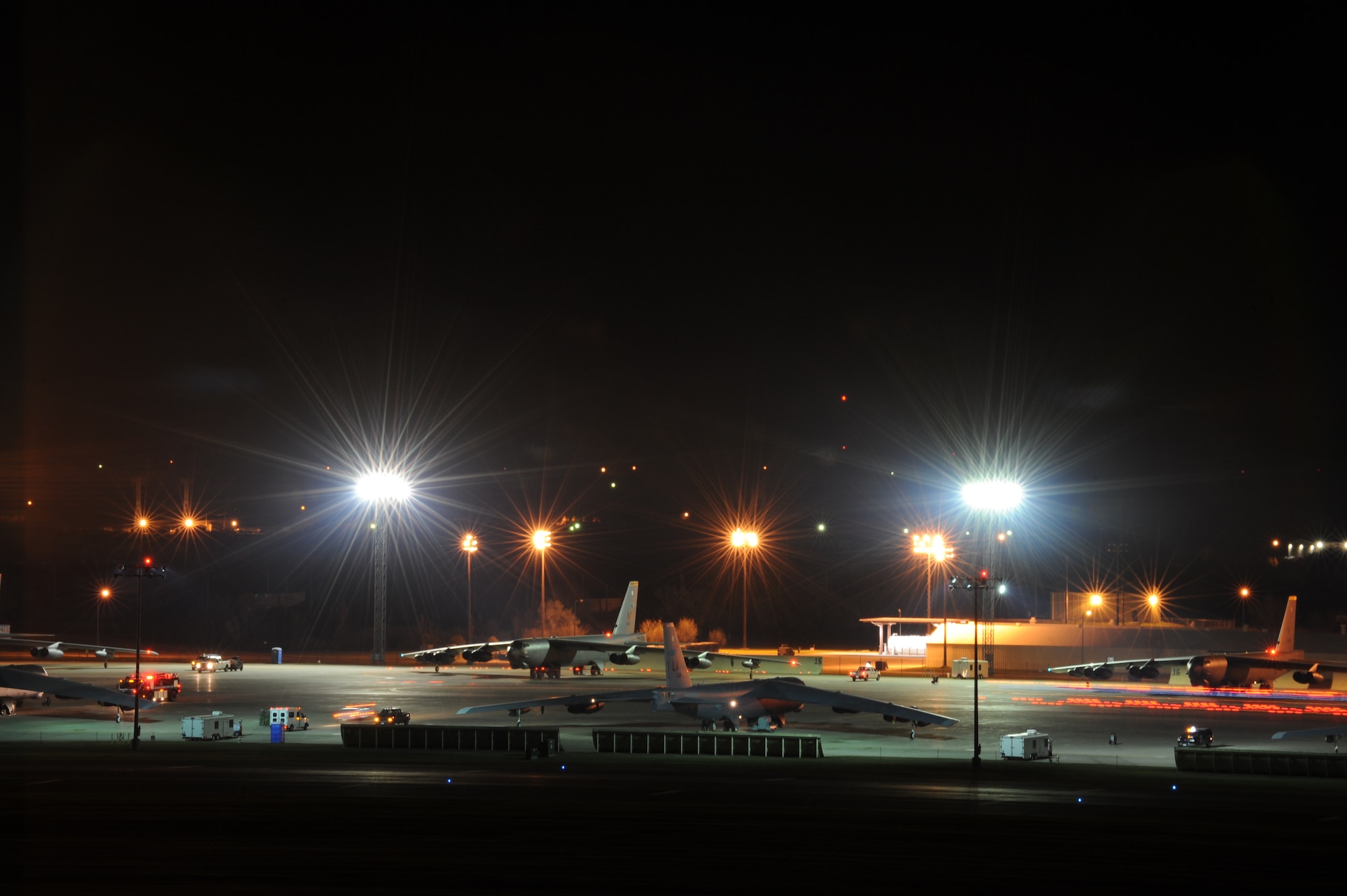 B-52H Stratofortresses wait to taxi at Minot Air Force Base, N.D., Oct. 26, 2014, during Global Thunder 15. During the exercise, a series of B-52s took off in rapid succession to test the response capabilities of the base. Global Thunder is a U.S. Strategic Command annual field training and battle staff exercise designed to exercise all mission areas with primary emphasis on nuclear command, control and communications. This field training and battle staff exercise provides training opportunities for components, task forces, units, and command posts to deter, and if necessary, defeat a military attack against the United States and to employ forces as directed by the president. (U.S. Air Force photo by Senior Airman Stephanie Morris.)