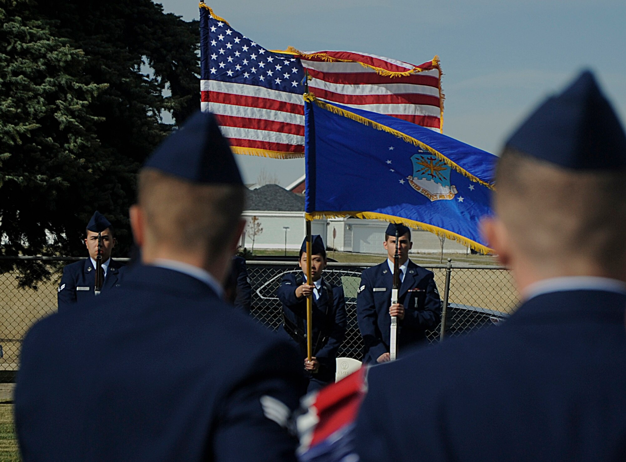 New honor guard graduates carry an empty casket towards the flag bearers Oct. 31 during a mock funeral at the F.E. Warren Air Force Base, Wyo., cemetery. Each graduate had a different responsibility to perform during the ceremony. (U.S. Air Force photo by Airman 1st Class Brandon Valle)