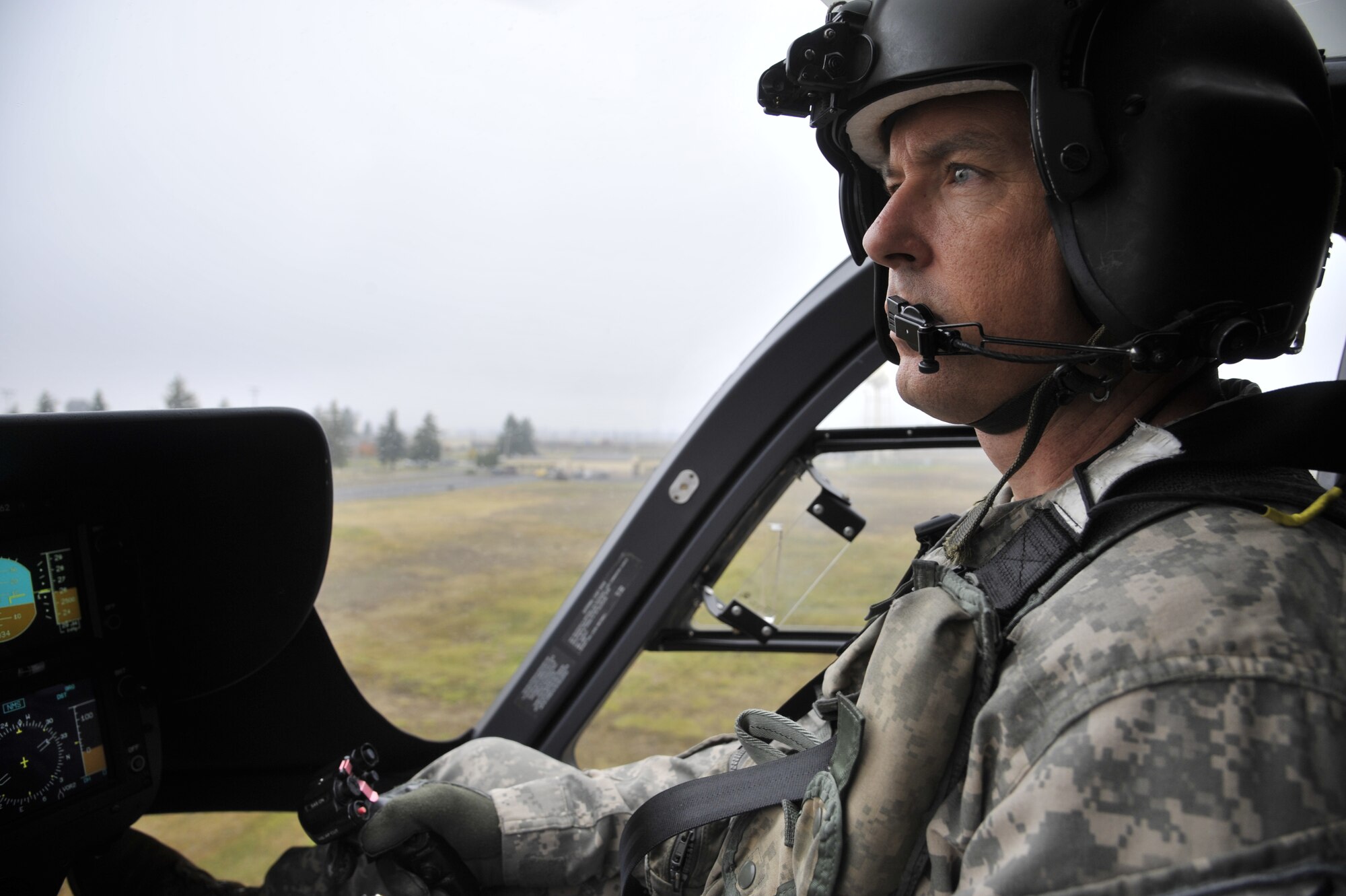 Chief Warrant Officer 4 Jay Enders, 168th Aviation Regiment, flies a UH-72 Lakota helicopter during a joint exercise with the 141st Medical Group, a unit of the Washington State Air National Guard, Oct. 31, 2014, at Fairchild Air Force Base, Wash. The exercise allowed 141st MDG members to simulate being flown into a combat environment to provide medical assistance to those in need. (U.S. Air Force photo/Senior Airman Mary O'Dell)