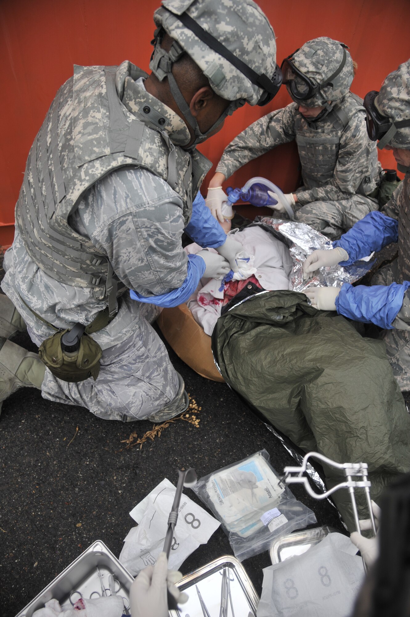 Capt. Nkumu Mandungu, 141st Medical Group, assists in repairing a simulated liver laceration during a joint exercise Oct. 31, 2014, at Fairchild Air Force Base, Wash. Mandungu was part of a five-man surgical team, all members of the Air National Guard, sent to provide assistance to patients in a simulated combat environment. (U.S. Air Force photo/Senior Airman Mary O'Dell)