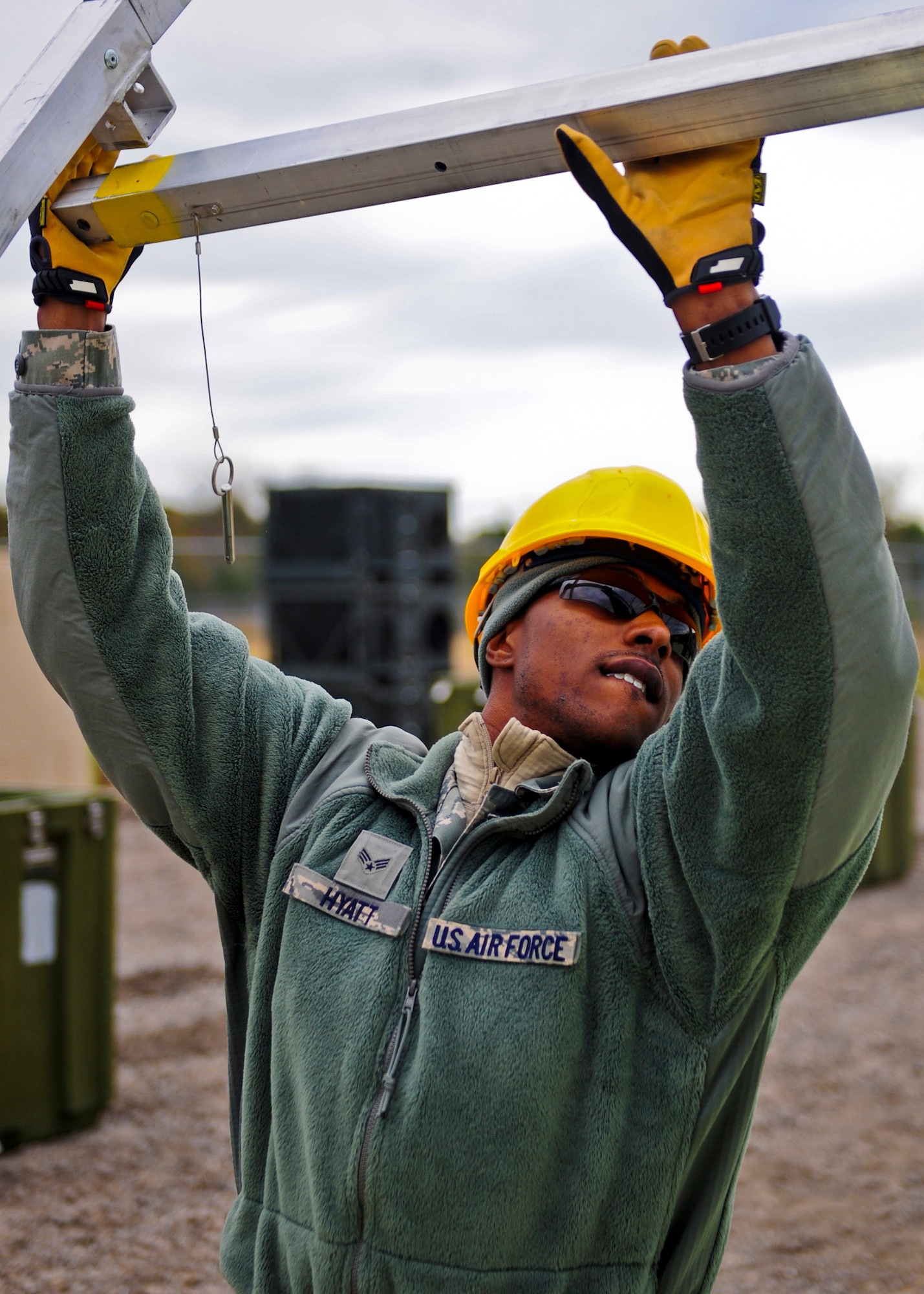 Senior Airman William Hyatt, with the 567th RED HORSE out of Seymour Johnson Air Force Base, North Carolina, builds a tent during a field training exercise at Fort Smith, Arkansas, Nov. 3, 2014. The exercise, also featuring the 560th RED HORSE out of Joint Base Charleston, South Carolina, and Airmen out of the 4th Fighter Wing at Seymour Johnson AFB, is hosting 174 participants to provide upgrade training and prepare for an upcoming operation in support of Beyond the Horizon. One of the primary objectives the units hope to complete is the building of a structure out of concrete masonry unit blocks, more commonly known as cinder blocks. The structure will be similar to the project they will be tasked to complete when they support Beyond the Horizon. Beyond the Horizon, conducted annually, is part of U.S. Army South and U.S. Southern Command’s humanitarian and civic assistance program, which works closely with host-nation forces and civilian organizations to provide medical, dental, and engineering support. (U.S. Air Force photo/Airman 1st Class Brittain Crolley)