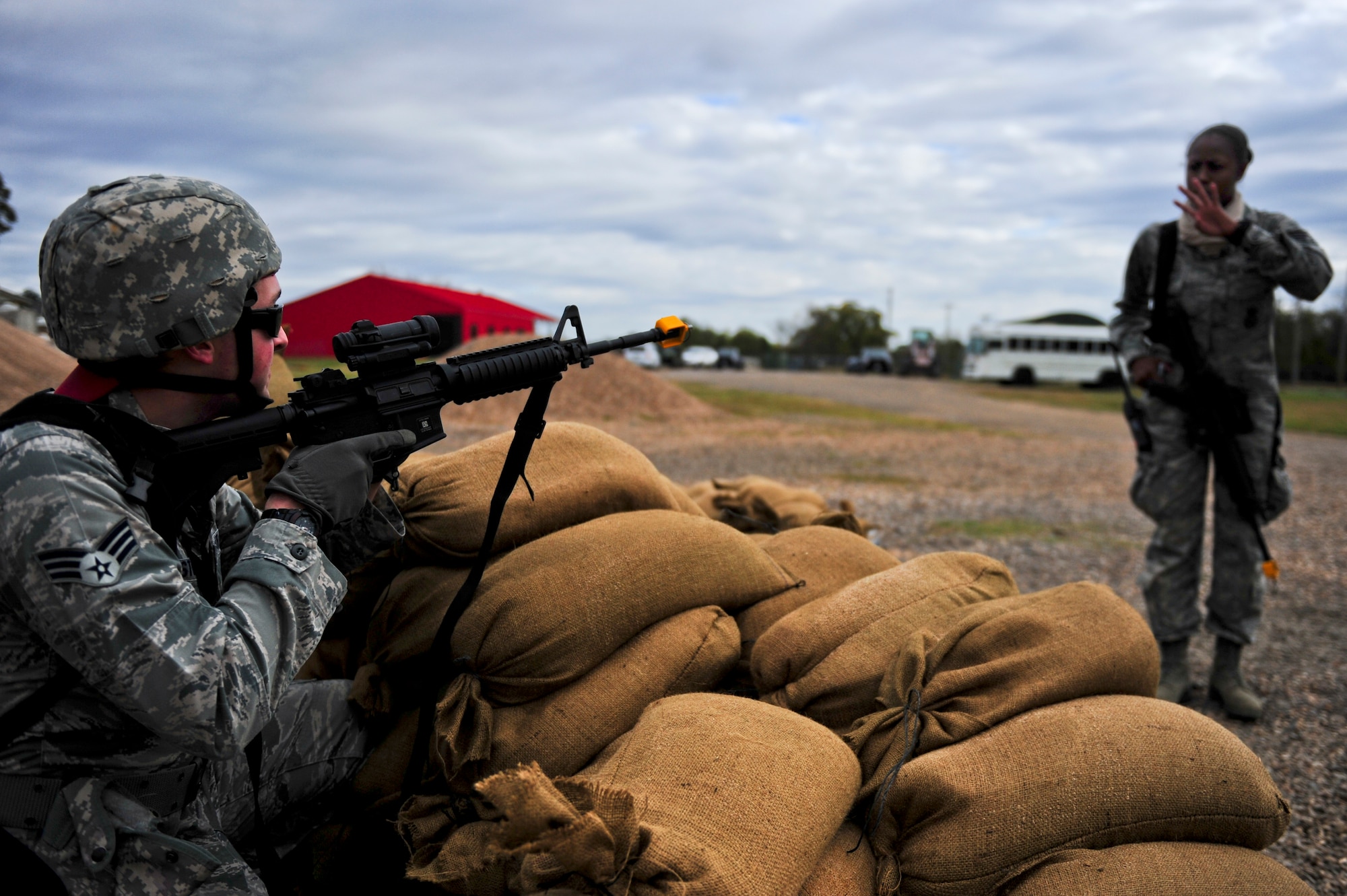 Senior Airman Johnathan Stogner, with the 567th RED HORSE out of Seymour Johnson Air Force Base, North Carolina, practices defensive security measures during a field training exercise at Fort Smith, Arkansas, Nov. 3, 2014. The exercise, also featuring the 560th RED HORSE out of Joint Base Charleston, South Carolina, and Airmen out of the 4th Fighter Wing at Seymour Johnson AFB, is hosting 174 participants to provide upgrade training and prepare for an upcoming operation in support of Beyond the Horizon. One of the primary objectives the units hope to complete is the building of a structure out of concrete masonry unit blocks, more commonly known as cinder blocks. The structure will be similar to the project they will be tasked to complete when they support Beyond the Horizon. Beyond the Horizon, conducted annually, is part of U.S. Army South and U.S. Southern Command’s humanitarian and civic assistance program, which works closely with host-nation forces and civilian organizations to provide medical, dental, and engineering support. (U.S. Air Force photo/Airman 1st Class Brittain Crolley)