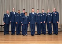 A group of Airmen pose for a photo at the base theater Oct. 31 during the monthly enlisted promotion ceremony. Congratulations to those Airmen who achieved the next step in their careers. (U.S. Air Force photo by Edward Cannon)
