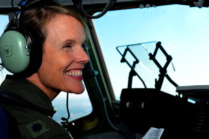 U.S. Air Force Lt. Col. Debi Rieflin, 315th Operation Support Squadron instructor pilot, smiles during her final (fini) flight in the C-17 Globemaster III conducted with an all female crew Oct. 27, 2014 at Joint Base Charleston, South Carolina. Rieflin is the first female C-17 aircraft commander with 21 years in the aircraft and retiring with 31 years in the Air Force. (U.S. Air Force photo/Senior Airman Sandra Welch)