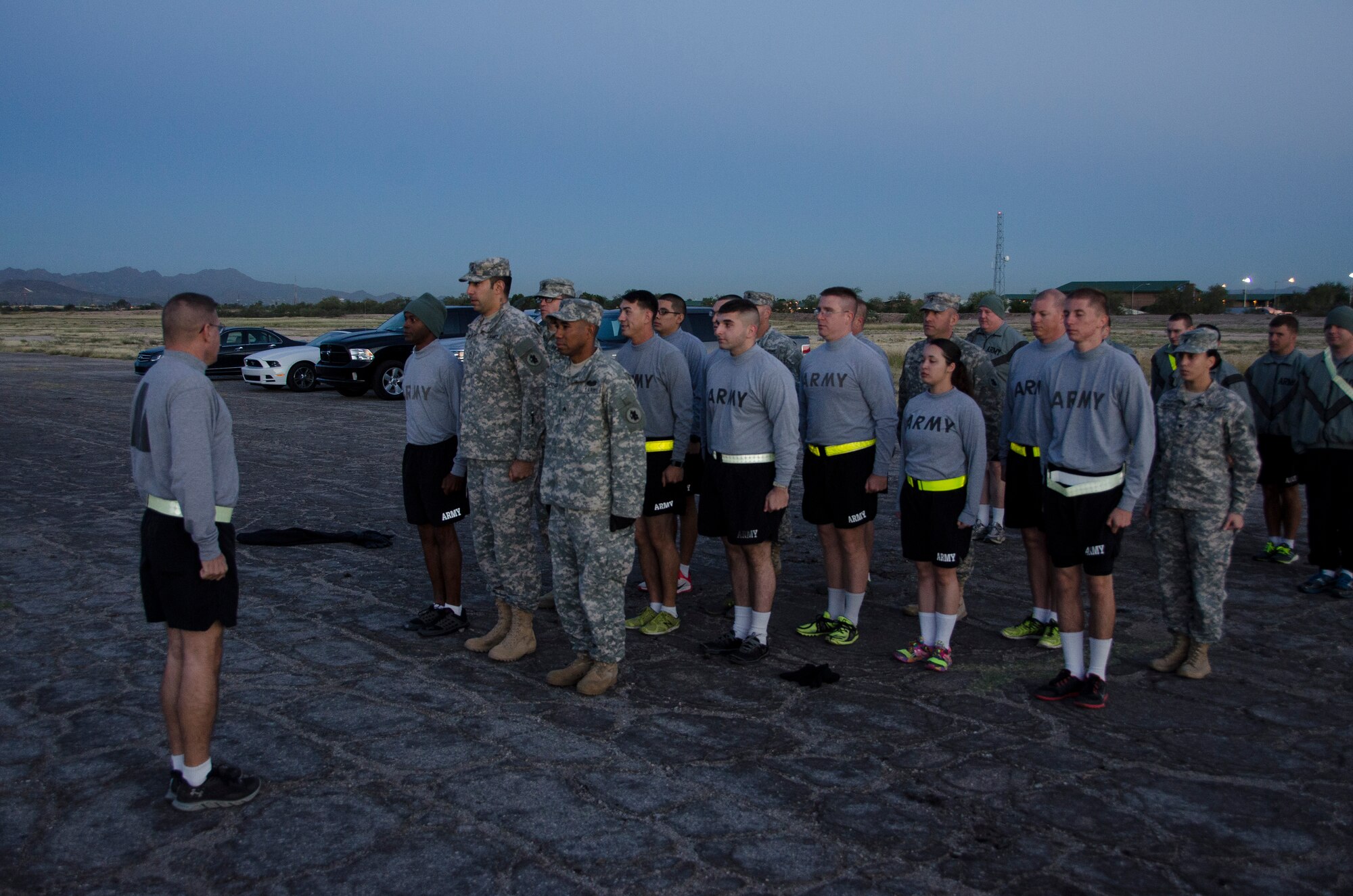 Sgt. Maj. Kazimier Kazimierowski, 1st Battlefield Coordination Detachment Sergeant Major, assesses soldiers during a formation before preparing to take the Army physical fitness test at Davis-Monthan AFB, Ariz, Nov. 4, 2014. The Army physical fitness test is broken down in to three events, push-ups, sit-ups and a two mile run. (U.S. Air Force photo by Staff Sgt. Adam Grant/Released) 