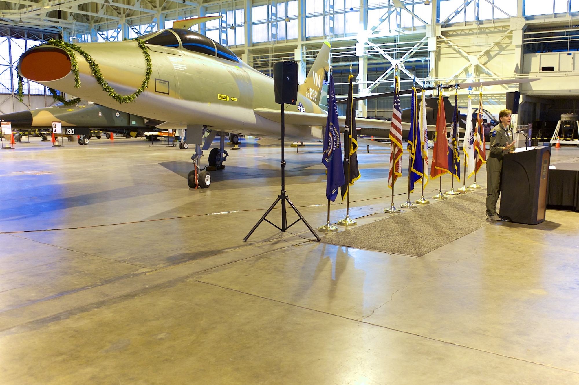 U.S. Air Force Gen. Lori J. Robinson, Pacific Air Forces commander, speaks during an F-100F Super Sabre aircraft dedication ceremony, Ford Island, Hawaii, Oct. 30, 2014.  The F-100F is a two-seat supersonic jet fighter used extensively by forward air controls during the Vietnam War.  The FACs, famously known by their call sign Misty, used specialized tactics and the fast F-100F to locate and mark targets for other aircraft to hit.  This F-100F was recently acquired and restored prior to its dedication at the Pacific Aviation Museum.  (U.S. Air Force by photo by Tech. Sgt. James Stewart/Released)