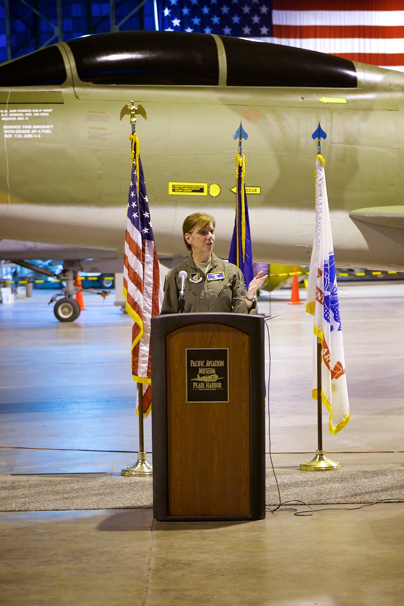 U.S. Air Force Gen. Lori J. Robinson, Pacific Air Forces commander, speaks during an F-100F Super Sabre aircraft dedication ceremony, Ford Island, Hawaii, Oct. 30, 2014.  The F-100F is a two-seat supersonic jet fighter used extensively by forward air controls during the Vietnam War.  The FACs, famously known by their call sign Misty, used specialized tactics and the fast F-100F to locate and mark targets for other aircraft to hit.  This F-100F was recently acquired and restored prior to its dedication at the Pacific Aviation Museum.  (U.S. Air Force by photo by Tech. Sgt. James Stewart/Released)
