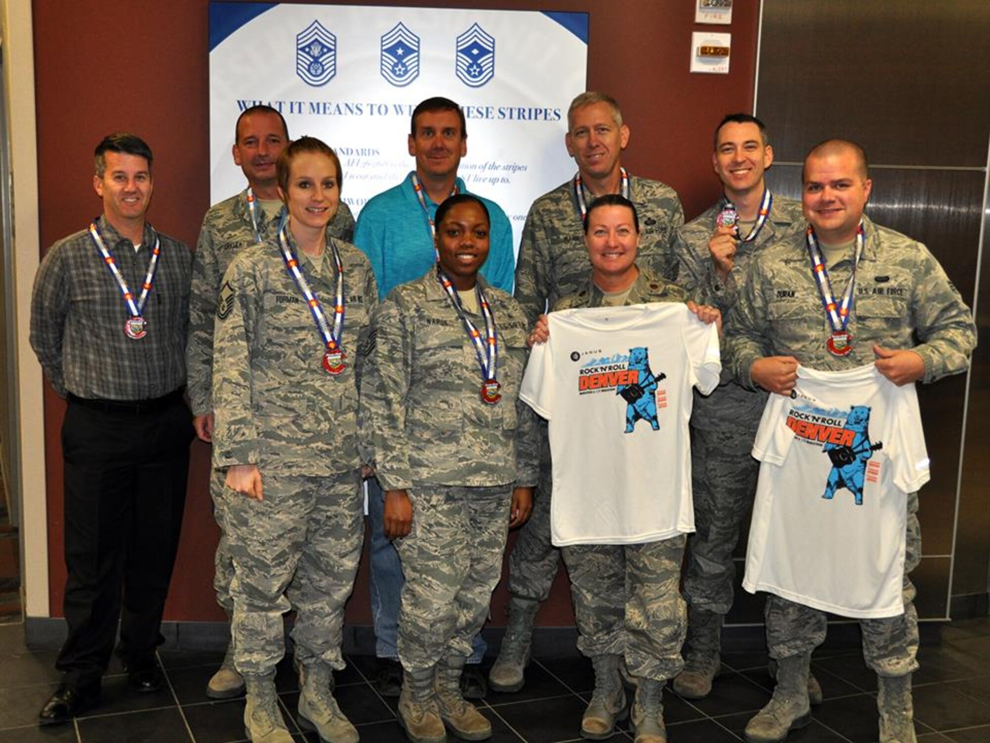 Ten members from the Air Reserve Personnel Center on Buckley Air Force Base, Colo., participated in the Janus Rock 'n' Roll Denver Marathon, half marathon, relay Oct. 19, 2014. The participants included Master Sgt. Rachel Forman, Maj. Susan Murphy, Tech. Sgt. Sabrina Napue, Senior Airman Timothy Duran, Jeff Noxon, Chief Master Sgt. James Kirkley, Robert Poe, Senior Master Sgt. Brian Marr and Tech. Sgt. Scott Spidel. Not pictured is Lt. Col. Belinda Petersen. (U.S. Air Force photo/Tech. Sgt. Rob Hazelett)