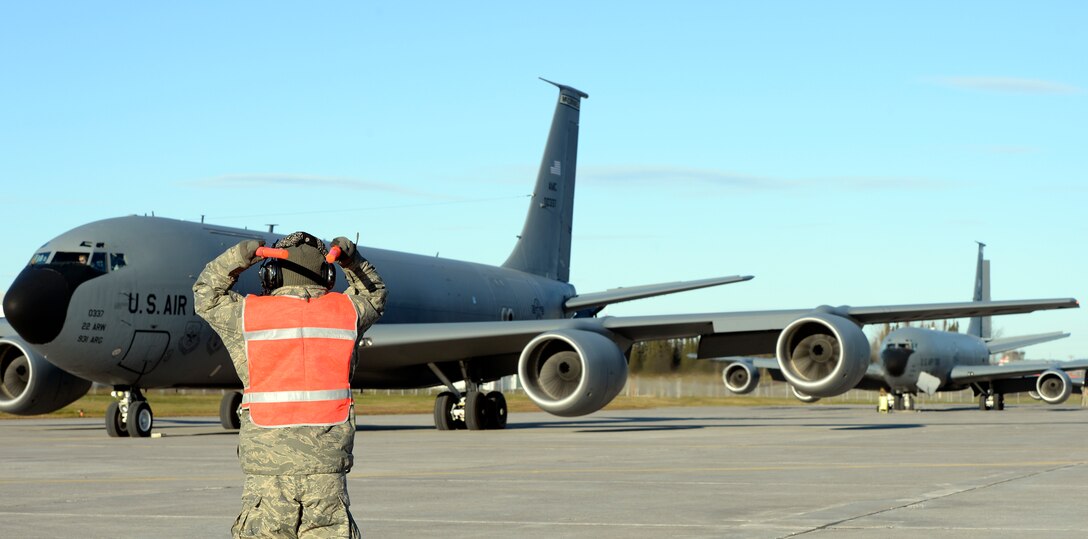 Staff Sgt. Joshua Hood marshals a KC-135 Stratotanker for takeoff during exercise Vigilant Shield 15 at 5 Wing Goose Bay, Newfoundland and Labrador, Oct. 23, 2014. The Vigilant Shield field training exercise is a bi-national NORAD Command exercise which provides realistic training and practice for American and Canadian forces in support of respective national strategy for North America’s defense. NORAD ensures U.S. and Canadian air sovereignty through a network of alert fighters, tankers, airborne early warning aircraft, and ground-based air defense assets cued by interagency and defense surveillance radars. (U.S. Air Force photo by Airman 1st Class Colby L. Hardin/Released)