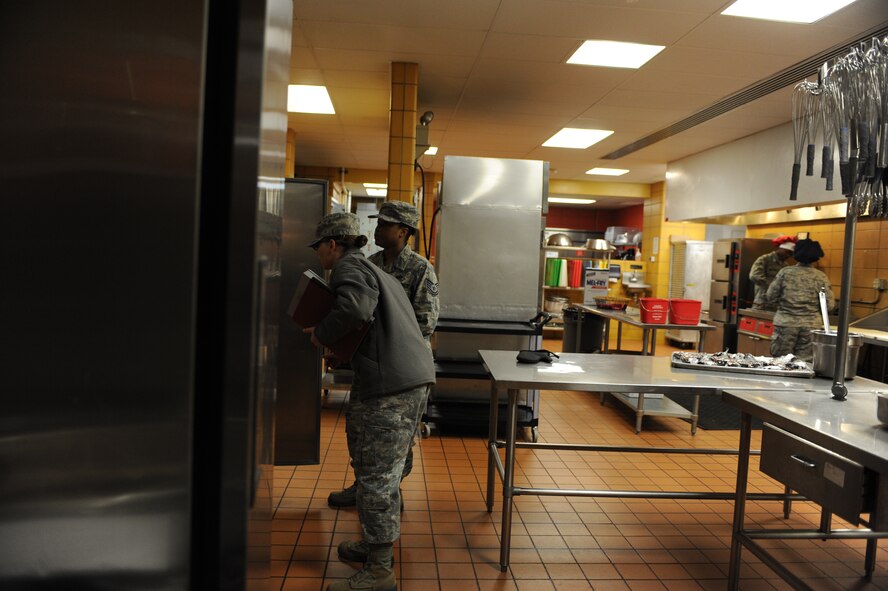 A food inspection is conducted in the kitchen of the dining facility on Minot Air Force Base, N.D., Oct. 28, 2014. Inspections at the dining facility are conducted monthly to ensure that proper food preparation and handling procedures are being met. (U.S. Air Force photo/Senior Airman Stephanie Morris)