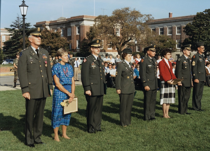 Peggy Tighe, U.S. Army Training and Doctrine Command diversity office director, served as a command sergeant major in the Army until retiring in 1990. In this photo, the-Command Sgt. Maj. Peggy Tighe, center, stands during her retirement ceremony from the Army. Tighe served more than 20 years in uniform before becoming an Army civilian employee. (Courtesy photo)    