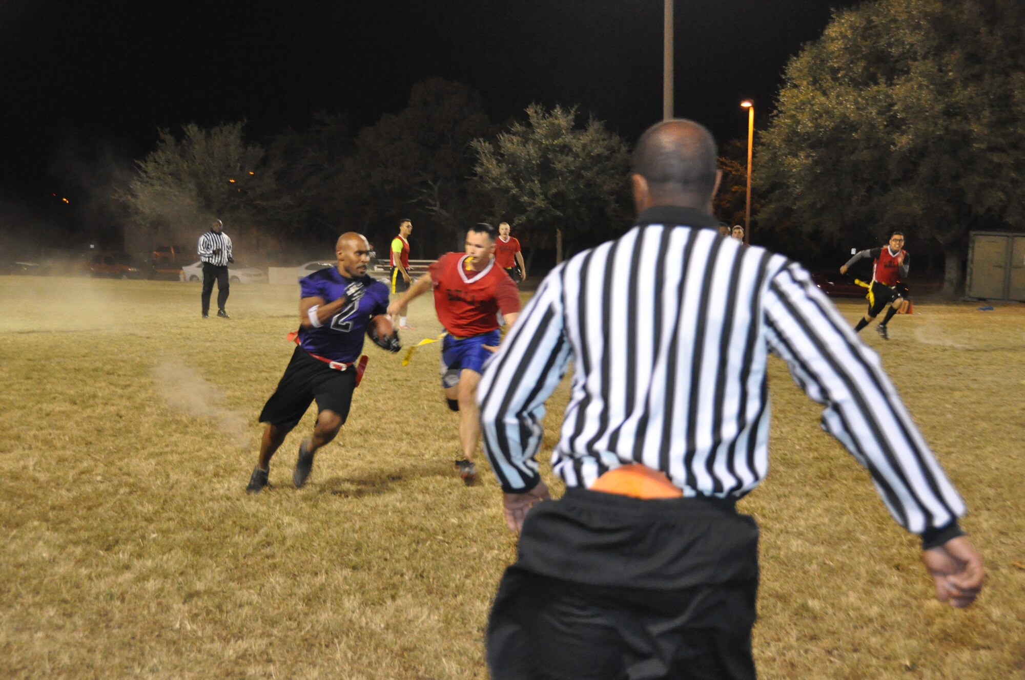 403rd Wing's Rodney Watson sprints past 335th players toward the end zone during the third round of the Keesler Air Force Base flag football playoffs Nov 3. (U.S. Air Force photo/Master Sgt. Brian Lamar)