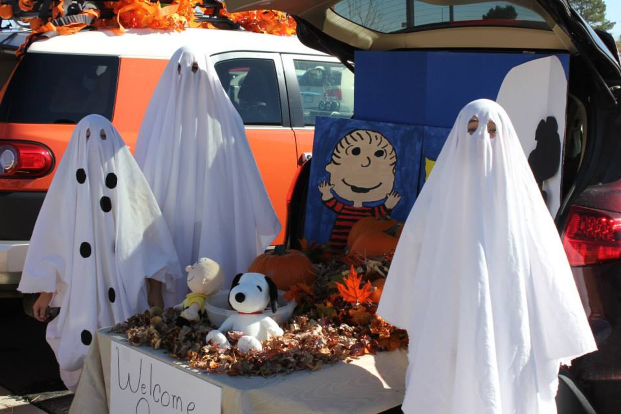 Children of Air Reserve Personnel Center employees packed the parking lot for their share of candy and fruit snacks during ARPC’s first trunk or treat event Oct. 30, 2014, on Buckley Air Force Base, Colo. The ARPC booster club sponsored the event, which drew more than 100 children who got a chance to view Halloween themes from 18 vehicles on display. (U.S. Air Force photos/Cindy Dewey)