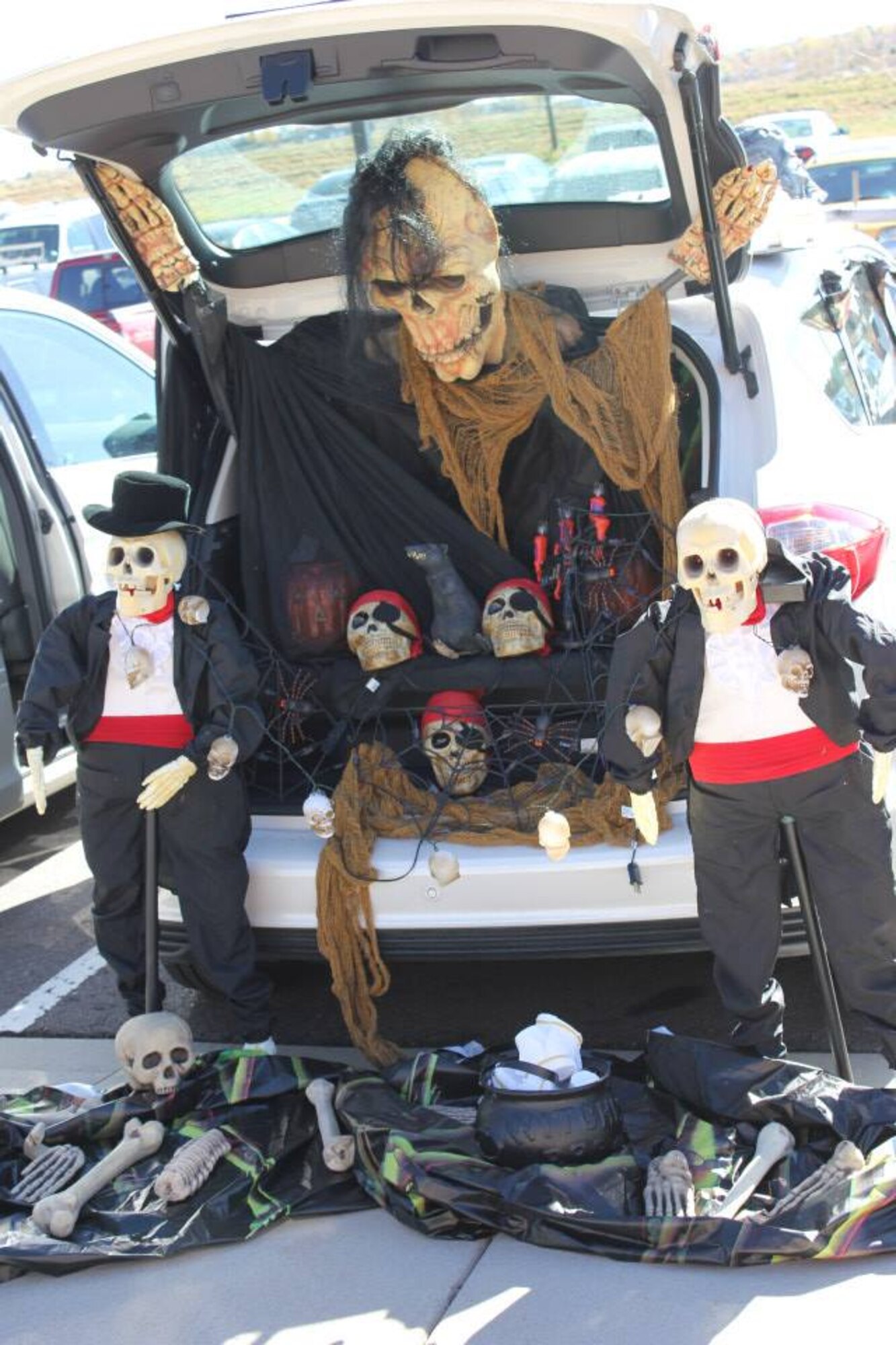 Children of Air Reserve Personnel Center employees packed the parking lot for their share of candy and fruit snacks during ARPC’s first trunk or treat event Oct. 30, 2014, on Buckley Air Force Base, Colo. The ARPC booster club sponsored the event, which drew more than 100 children who got a chance to view Halloween themes from 18 vehicles on display. (U.S. Air Force photos/Cindy Dewey)
