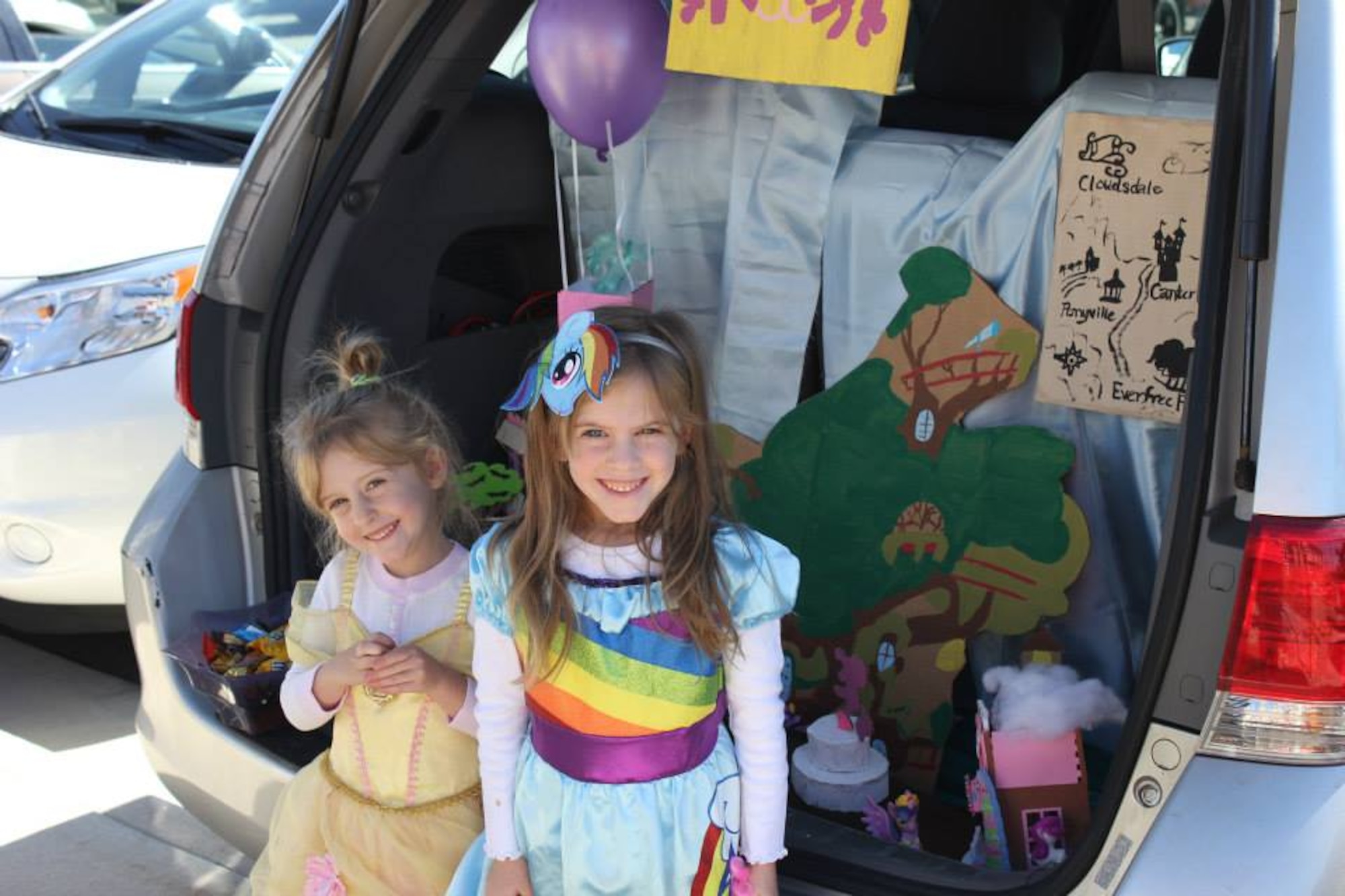 Children of Air Reserve Personnel Center employees packed the parking lot for their share of candy and fruit snacks during ARPC’s first trunk or treat event Oct. 30, 2014, on Buckley Air Force Base, Colo. The ARPC booster club sponsored the event, which drew more than 100 children who got a chance to view Halloween themes from 18 vehicles on display. (U.S. Air Force photos/Cindy Dewey)