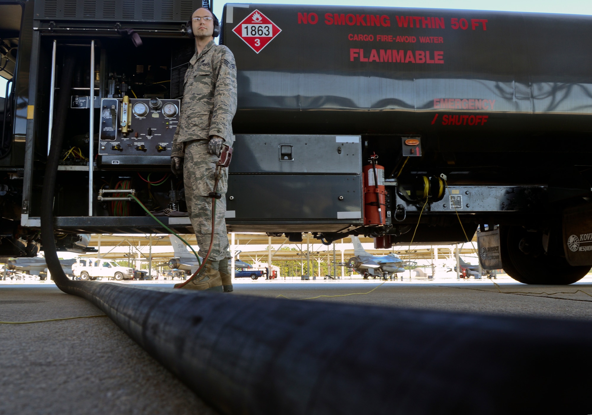 U.S. Air Force Senior Airman Samuel Sharrar, 20th Logistics Readiness Squadron fuels distribution operator, pumps fuel at Shaw Air Force Base, S.C., Oct. 30, 2014. Refueling jets is one of the main tasks. (U.S. Air Force photo by Senior Airman Ashley L. Gardner/Released)
